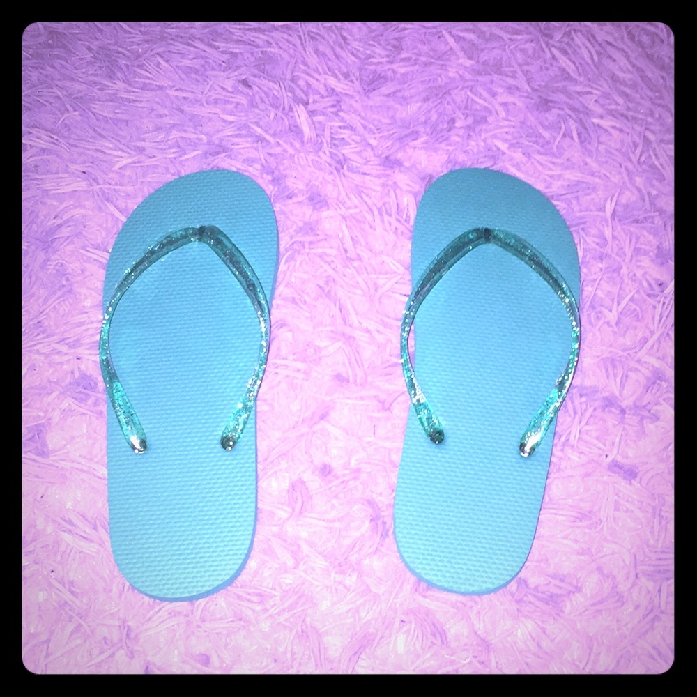Never worn women’s sparkly flip flops